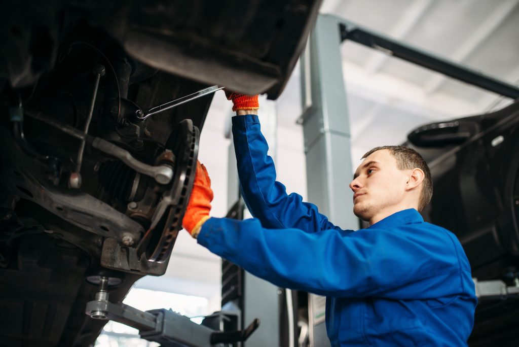 mechanic repairing car suspension in auto repair s 2026 03 13 04 20 38 utc
